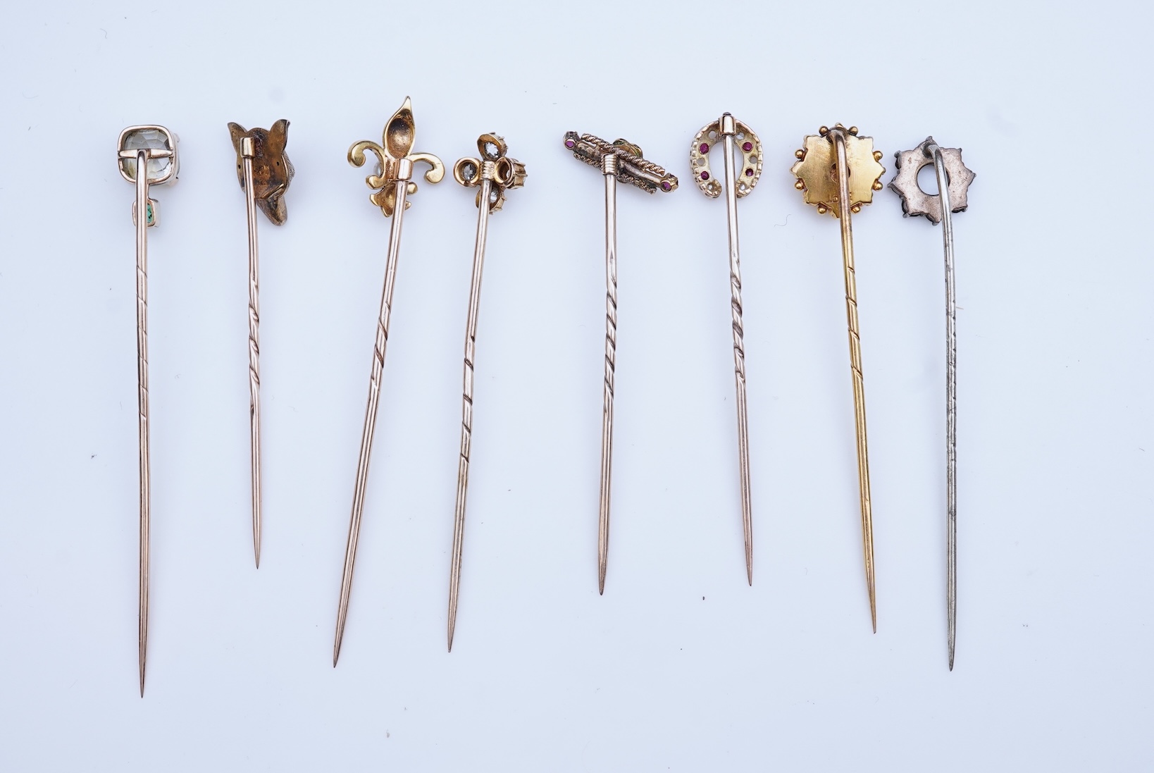 A collection of eight tie pins, 19th and 20th century